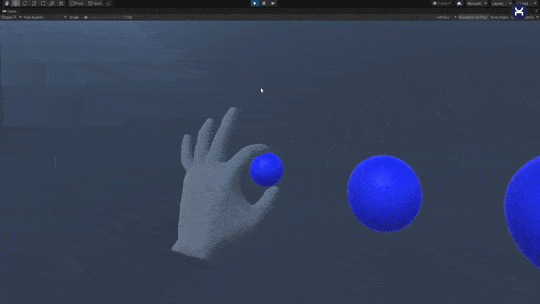 Animation of a tracked virtual hand pinching a blue sphere in VR